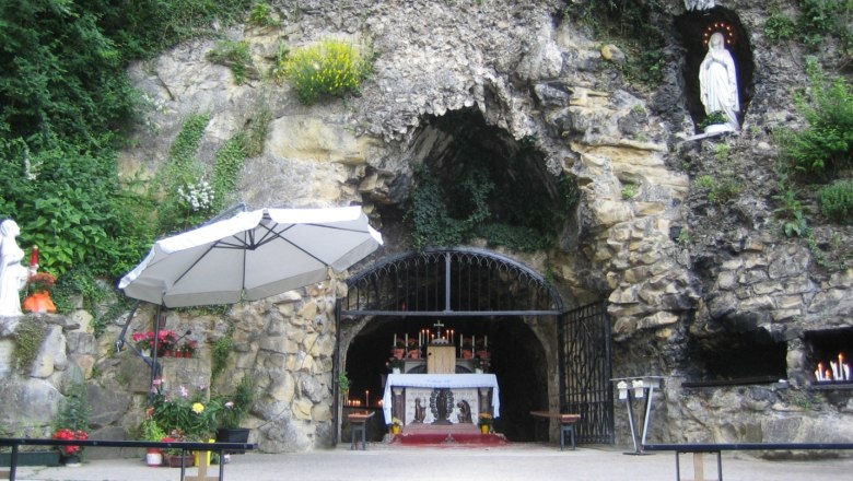 Lourdes Grotto in the Vienna Woods, © LG Lourdes grotto in the Vienna Woods with altar and statue of the Virgin Mary.